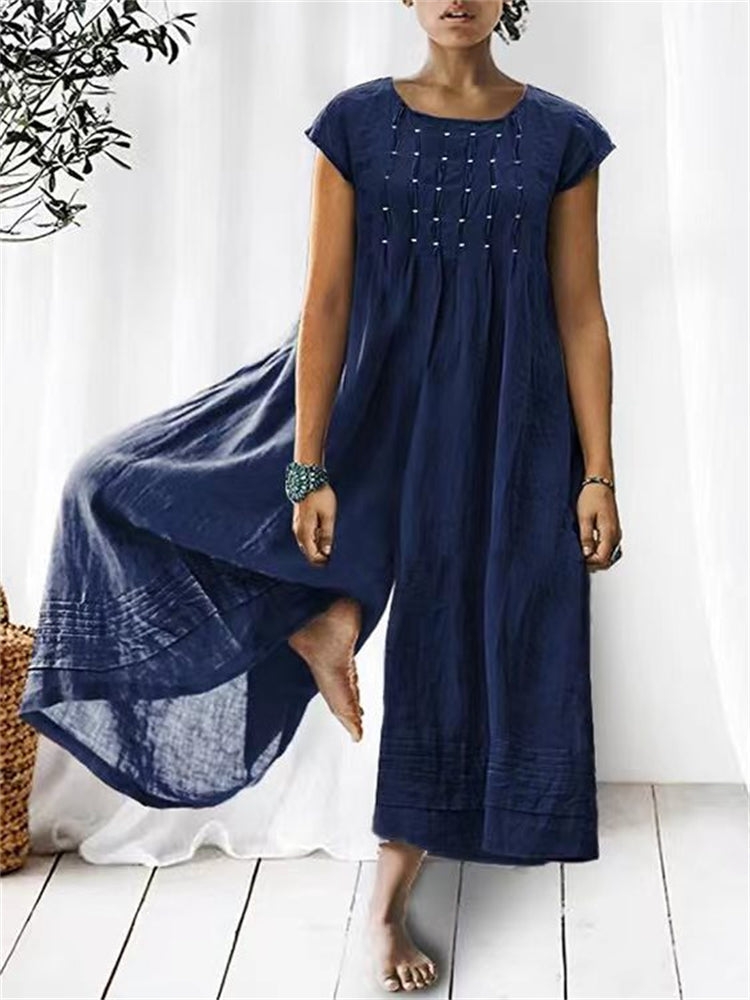 Plisserad jumpsuit med vida ben