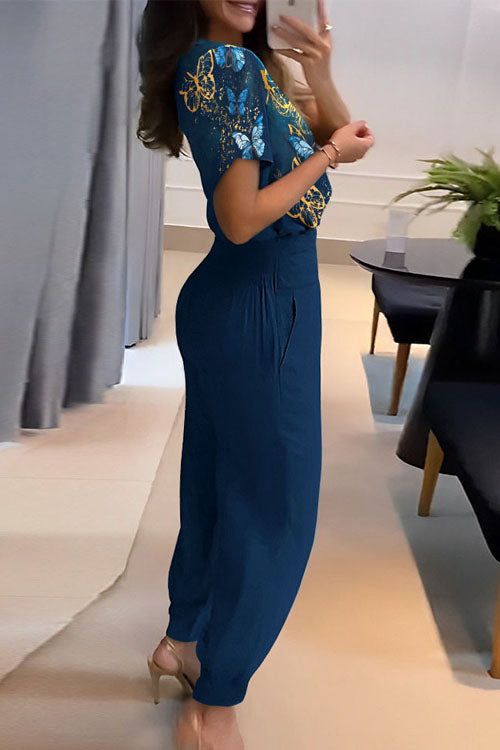 Set med två delar, långbyxor, kort ärm och V-ringning, med avslappnat mönster