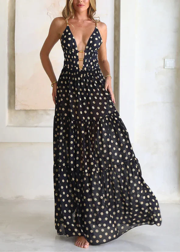 Bikini och kjol med svarta och gyllene prickar