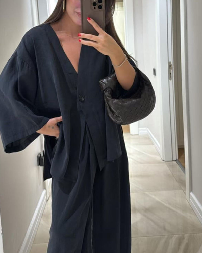 Set med två delar: casual topp med V-ringning och byxor