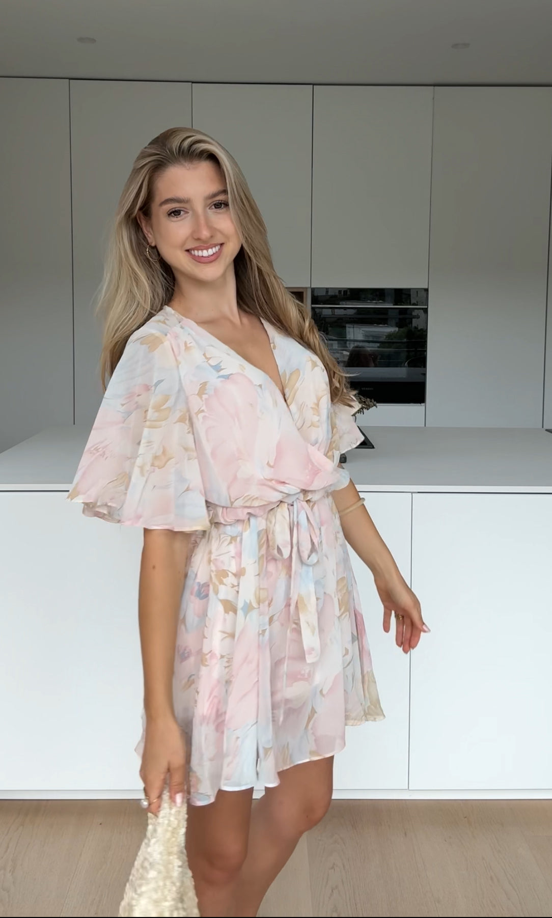 MINIKLÄNNING MED BLUMMAR