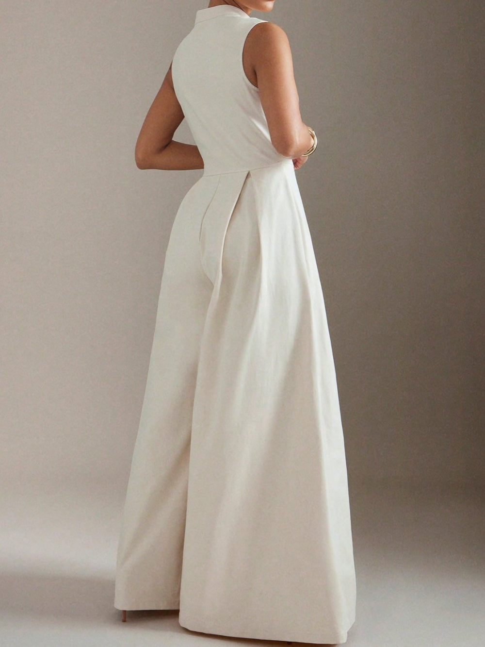 Ärm- och benlös jumpsuit med dragkedja och vida ben