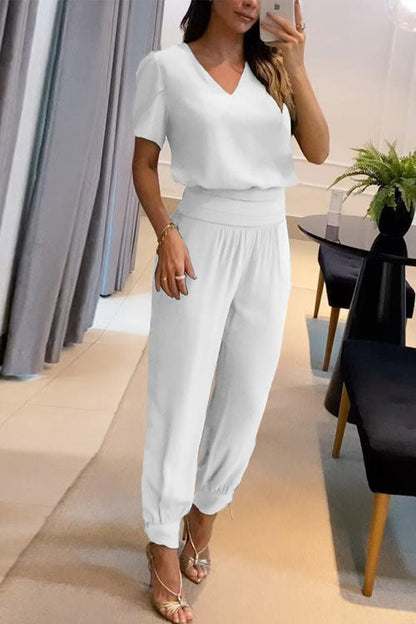 Set med två delar, långbyxor, kort ärm och V-ringning, med avslappnat mönster