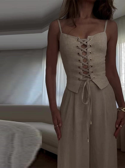 Set med två delar med axelband och rosett i linneblandning