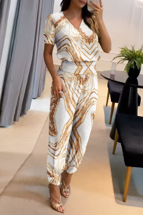 Set med två delar, långbyxor, kort ärm och V-ringning, med avslappnat mönster