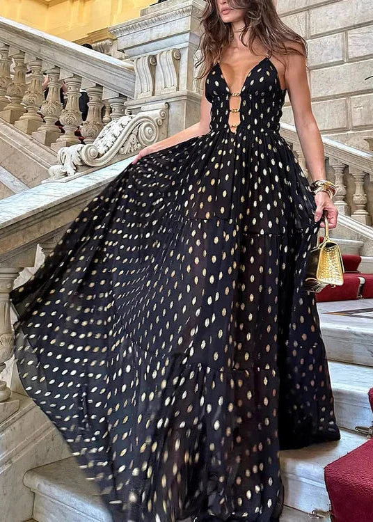 Bikini och kjol med svarta och gyllene prickar