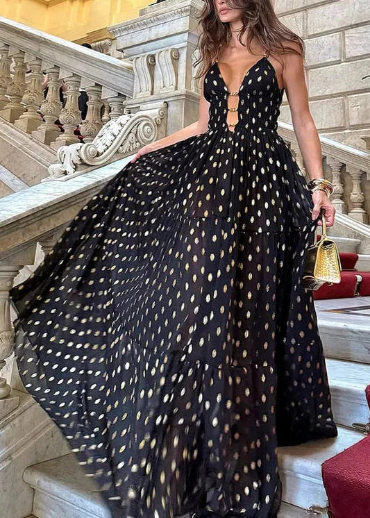 Bikini och kjol med svarta och gyllene prickar