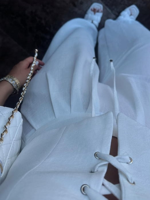 Set med två delar med axelband och rosett i linneblandning