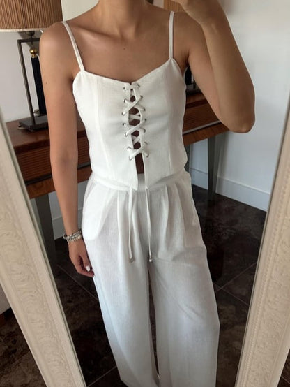 Set med två delar med axelband och rosett i linneblandning