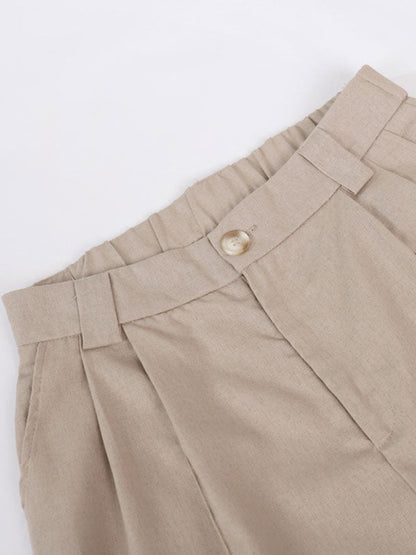 Breda byxor i bomull och lin, med veck, med klassisk V-ringning