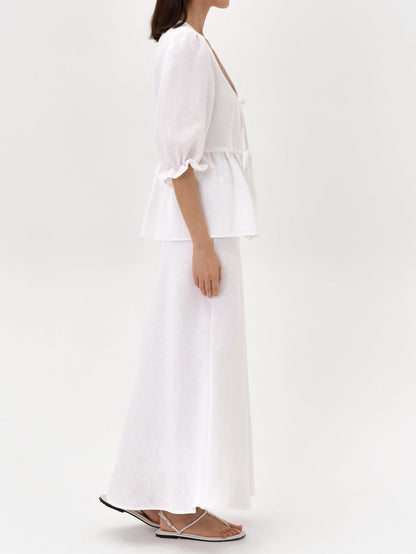 Gul topp med V-ringning och medellånga ärmar, högmidjad kjol, linne-set