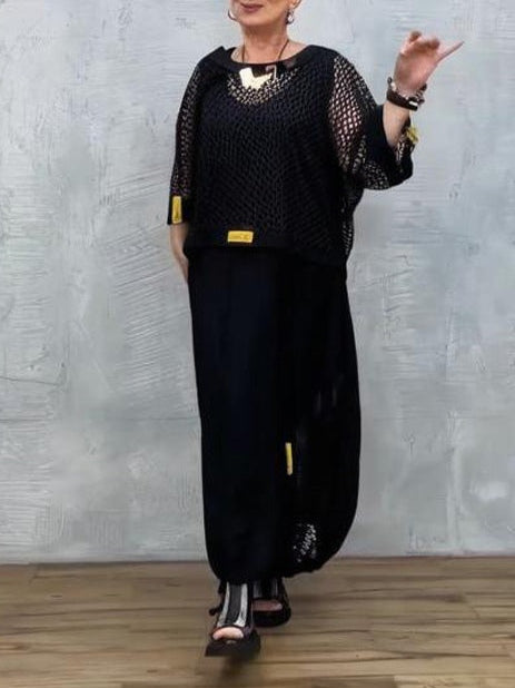 Klänning utan ärmar i svart mesh och matchande överdrag