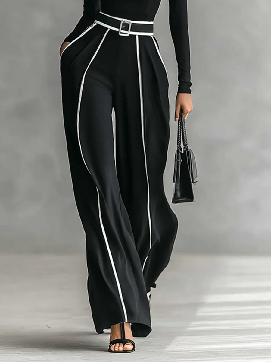 Set cu top cu guler înalt și mâneci lungi, cu pantaloni largi și curea