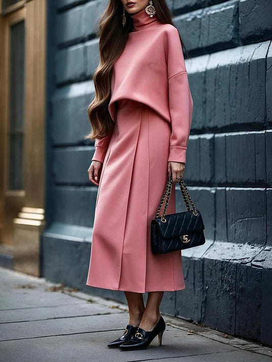 Set med två delar: Top med hög krage och midi kjol