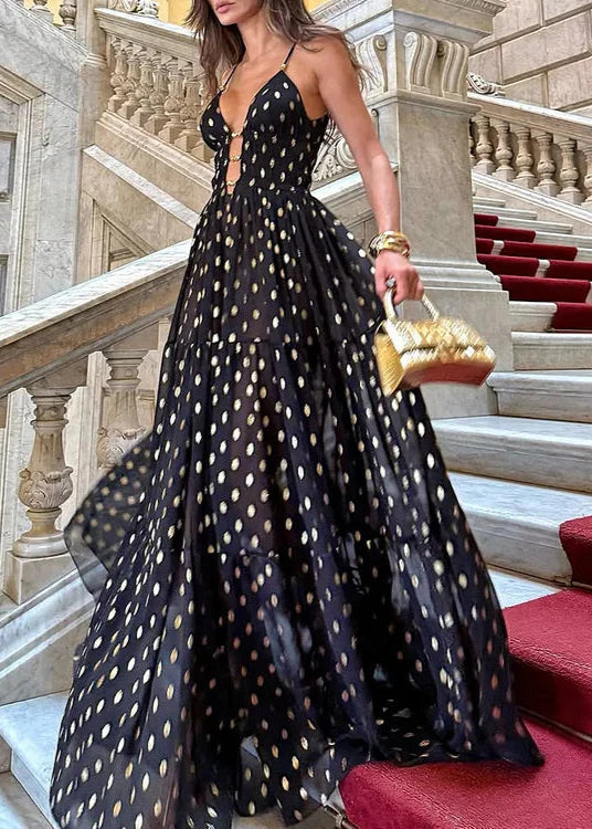 Bikini och kjol med svarta och gyllene prickar