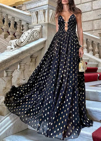 Bikini och kjol med svarta och gyllene prickar