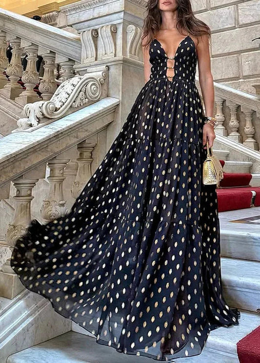 Bikini och kjol med svarta och gyllene prickar